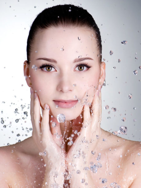Drops of water around the beautiful woman face